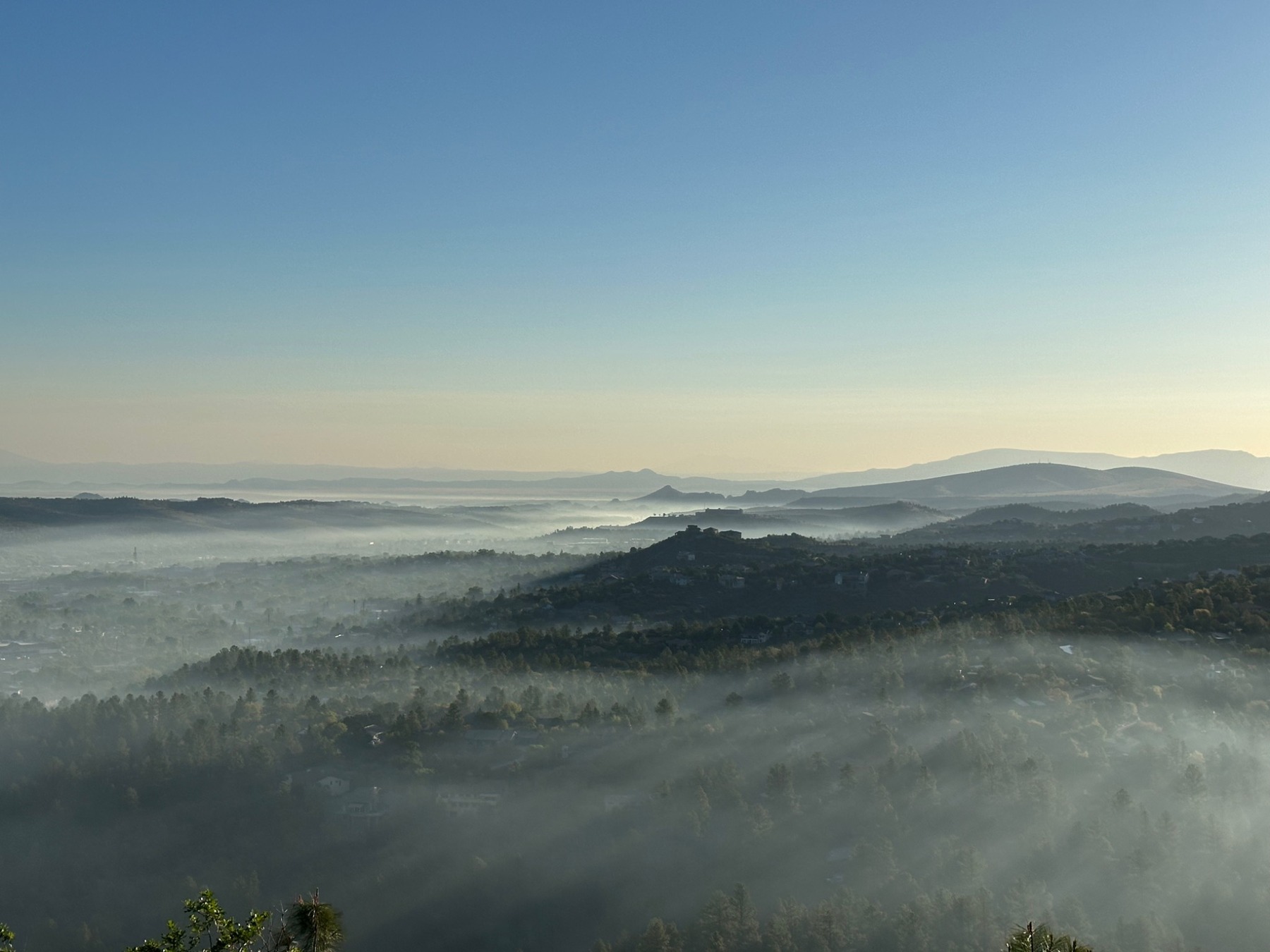 Misty morning mountain views over Prescott from Kuhne Hill Estates.
